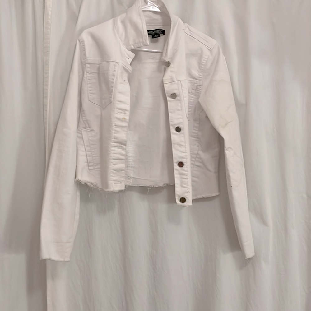 A white jean jacket, in a medium in woman’s.